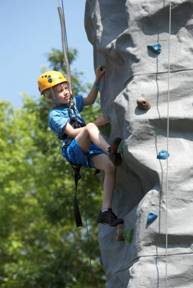 Image of a young boy tries climbing